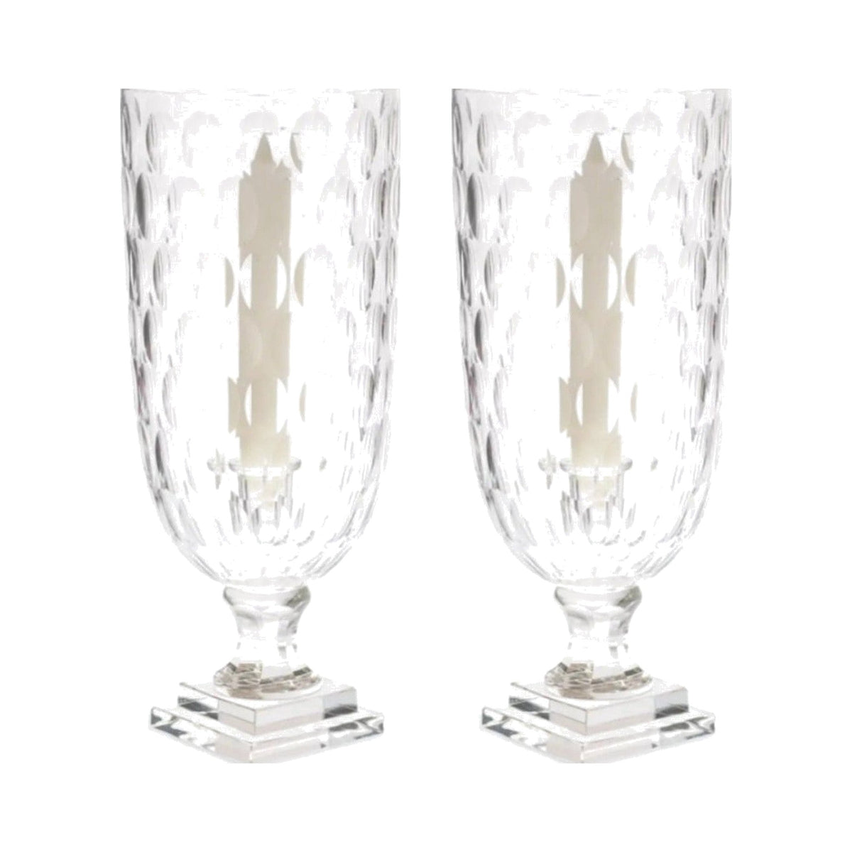 Pair of etched glass candlestick hurricanes on a white background