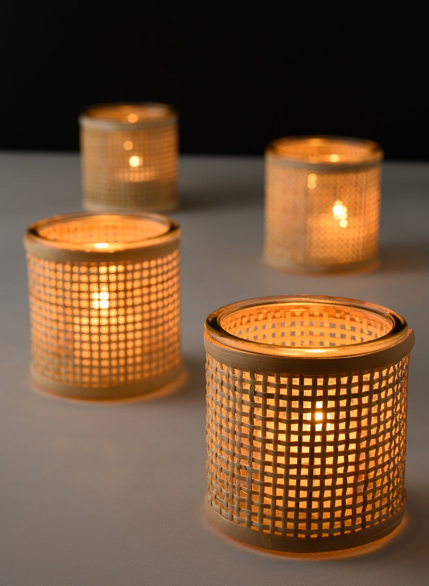 Haiphong Cane Weaved Glass Votives glowing with tea lights