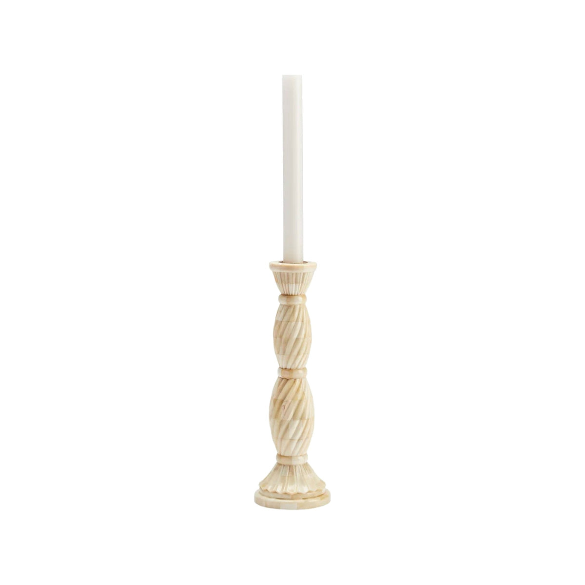 Twisted inlay bone candlestick with taper candle on a white background