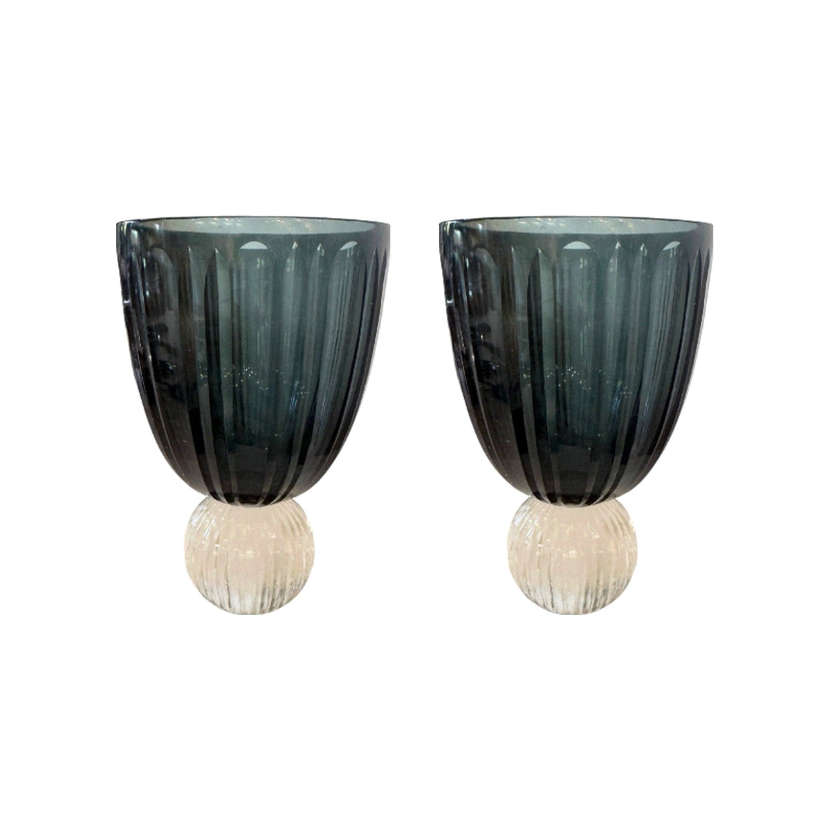 Pair of two-tone rippled cut teal glass hurricanes on a white background